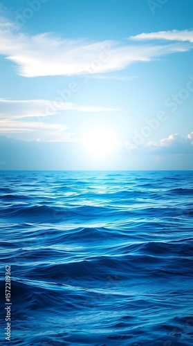 Wallpaper Mural Serene ocean view, blue water waves under a bright sky with clouds Torontodigital.ca