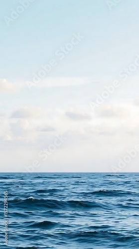 Wallpaper Mural Gentle ocean waves under a pastel sky with soft cloud formations Torontodigital.ca