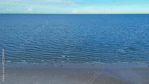Blue sea and empty beach captured by drone