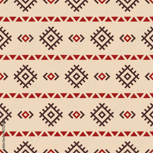 Abstract ethnic seamless geometric pattern. Tribal and ethnic motif seamless background. Color vector background. Red and brown color ornament. Design for background, cloth, wrapping, batik, fabric.