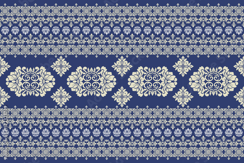 Seamless white and yellow floral damask shape with tradition pattern texture on navy blue background	
