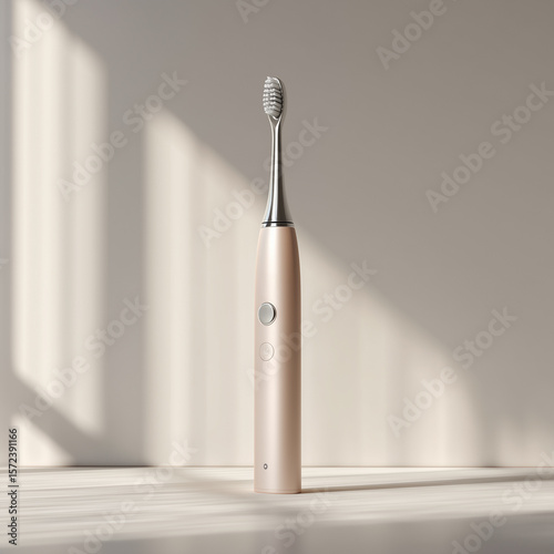 Modern electric toothbrush isolated on neutral background under warm light