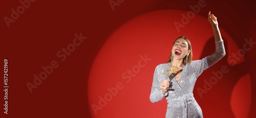 Happy young woman with glas...