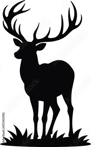Vector art of silhouette of a majestic stag with large antlers standing in grass isolated on white background