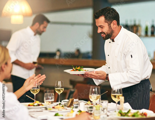 AI generated image of an executive chef in full whites gesturing to welcome diners into an elegant fine dining restaurant in a hotel.
