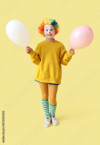 Funny little girl in clown ...