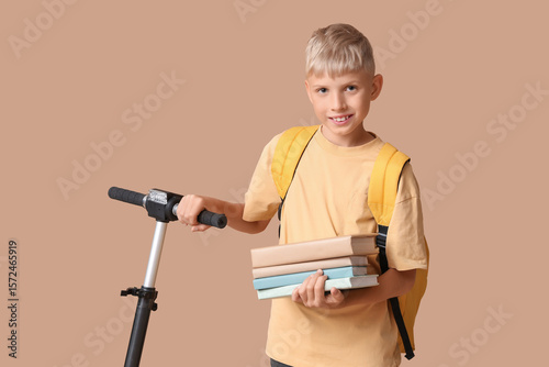 Cute schoolboy with modern ...