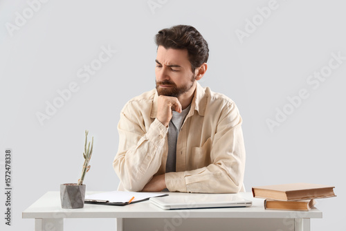 Portrait of worried man at ...