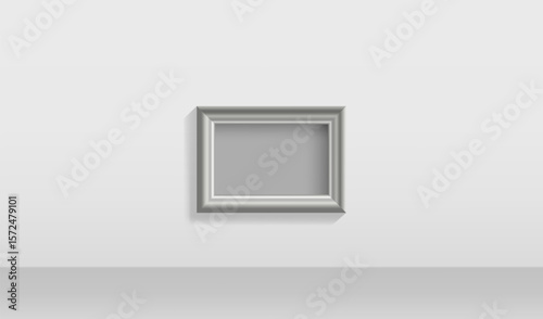 Bright room with empty frame on the wall