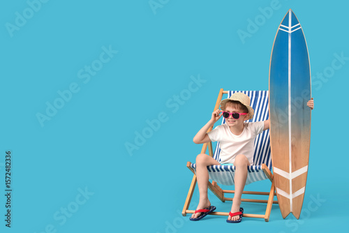 Cute little boy with surfbo...