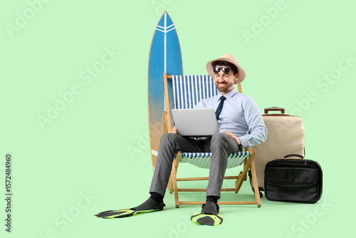 Young businessman with lapt...