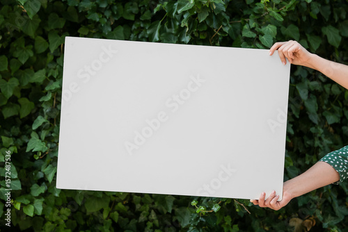 Female hands holding blank ...