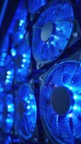 Intense macro view of cooling fans rotating rapidly with a serene blue light radiating from LED indicators enhancing the modern texture of a hightech server room.