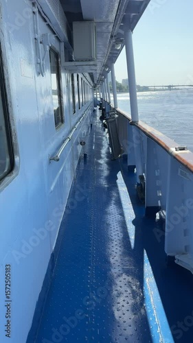 Lower deck of a river cruise ship designated for crew members, featuring narrow corridors and functional working areas.