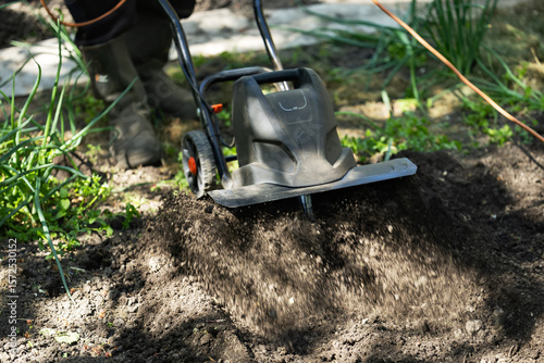 Wallpaper Mural Garden tiller, rotary tiller, mini cultivator or rotavator. Tillers break up compacted soil, improve its structure and aeration. Torontodigital.ca