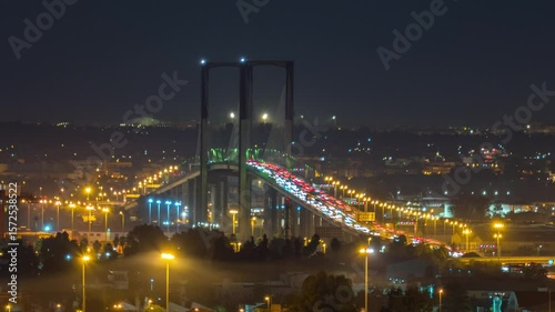 Night Timelapse of Puente Centenario with Car Traffic in Seville