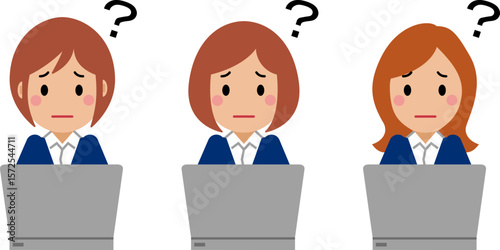 困り顔でパソコンを操作する紺色スーツの若い女性