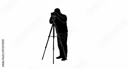 Silhouette of Photographer with Tripod Taking Photos on White Background