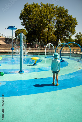 Child at a Blue and Green Splash Pad