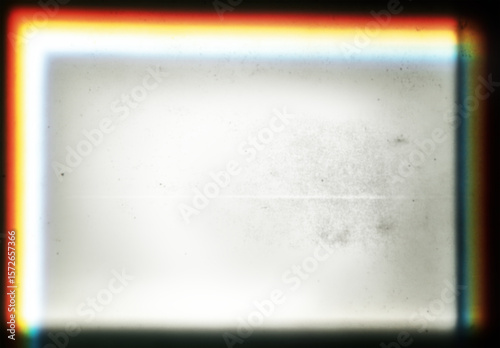 Transparent vintage-style film overlay with burned edges and colorful light effects. Damaged texture featuring dust, scratches, and stains, retro nostalgic analog photography