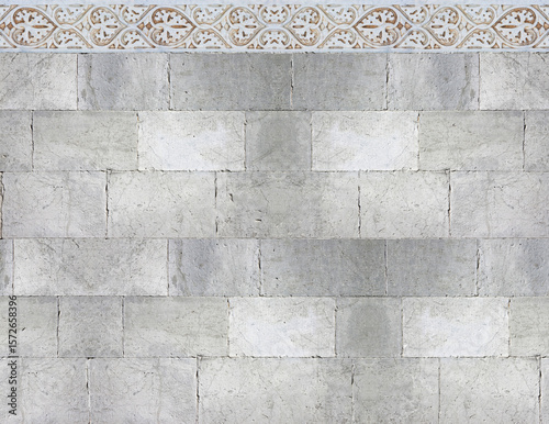 Quadro su tela Old white stone wall with geometric molding stone eaves - image with copy space