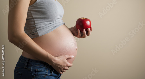 Pregnant Woman Holding a Red Apple, Third Trimester Diet for Gestational Diabetes