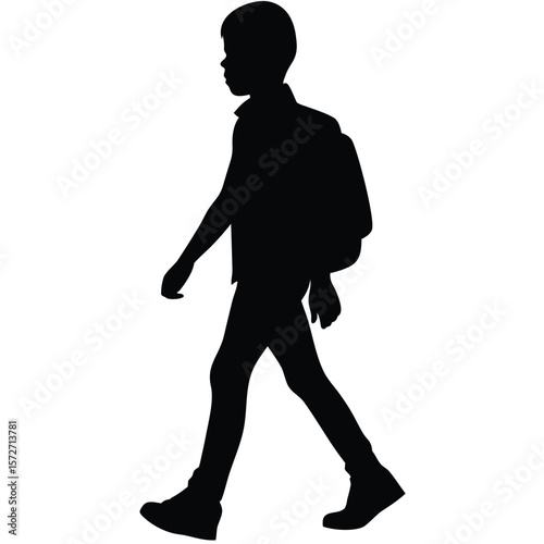 Silhouette of a Schoolboy Walking with Backpack