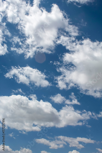 Vertical blue sky with clouds Background