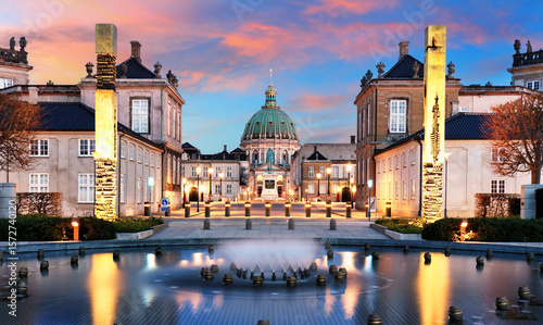 Copenhagen - Beautiful fountain at the Royal Danish Palace Amalienborg at dramatic sunrise. Royal residence, Denmark