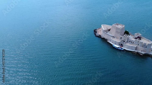 Bourtzi castle in the center of Greek port seen from drone
