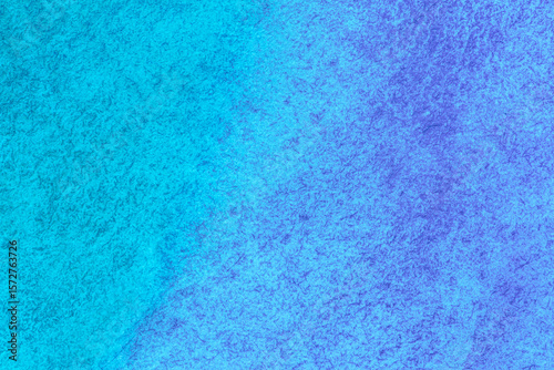 artistic backdrop: close up of canvas texture stained with blue and azure color paints