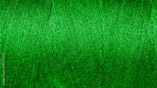 green cotton threads with visible details. background