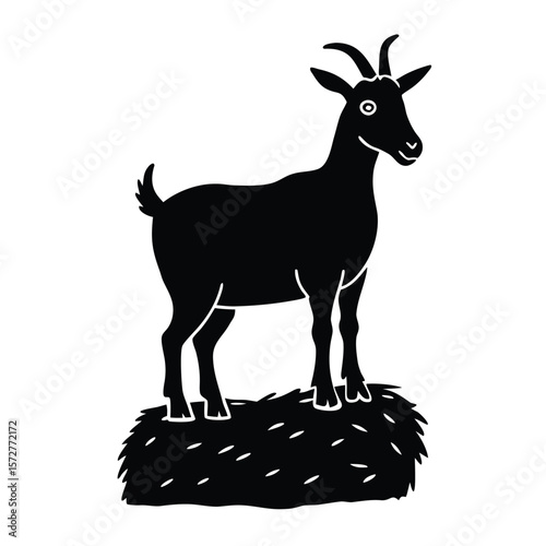 A striking black silhouette of a goat standing proudly on a rock or hay bale conveying a sense of nature and farm life