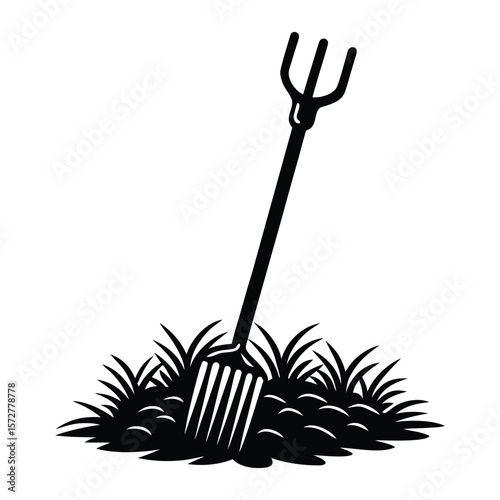 Farmyard scene with a pitchfork stuck in a hay pile barn view silhouette