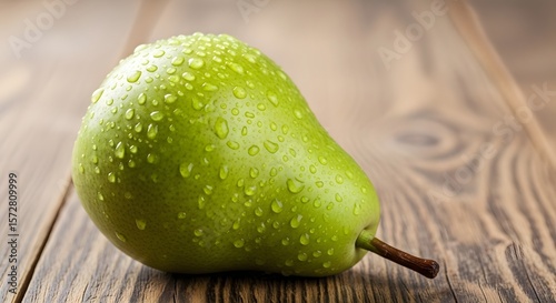 Wallpaper Mural Fresh pear with droplets of water resting on textured wooden surface under soft morning light Torontodigital.ca