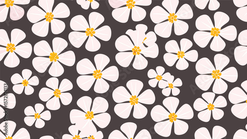 Seamless pattern of white flowers with yellow centers on a dark background creates a floral design
