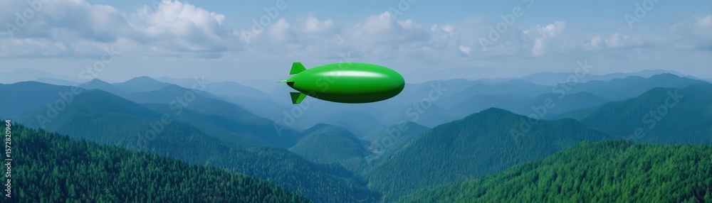 Fototapeta premium Green Blimp Floating Over Serene Mountains Under Blue Sky with Fluffy Clouds