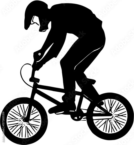 silhouette of a man riding a bicycle