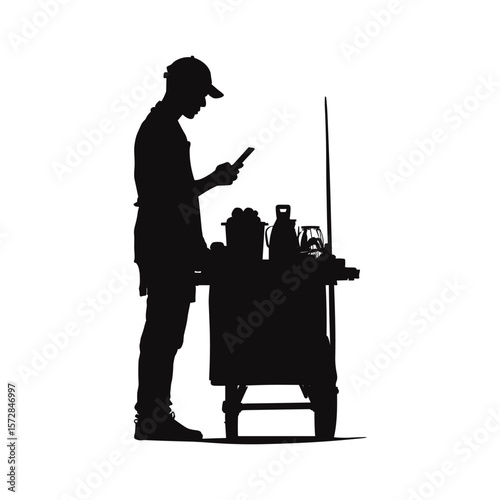 Street Vendor Cooking Food in Cart