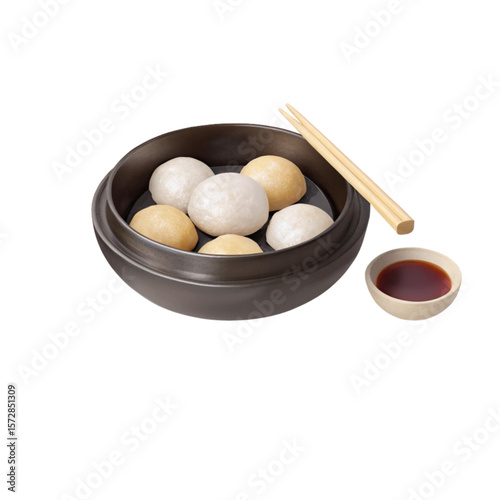 Black bowl of tangyuan dessert with glutinous rice balls and sweet soy dipping sauce