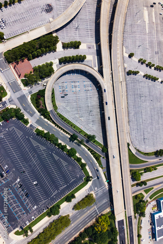 Complex highway system and urban parking lot on a sunny summer day