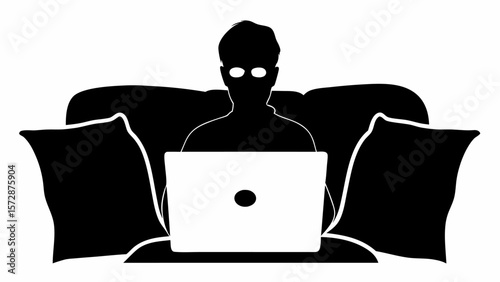 Silhouette of a person sitting on a couch with pillows using a laptop computer in black and white style