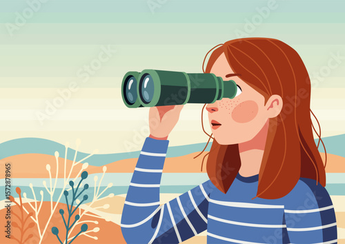 A girl looks through binoculars against a hilly landscape
