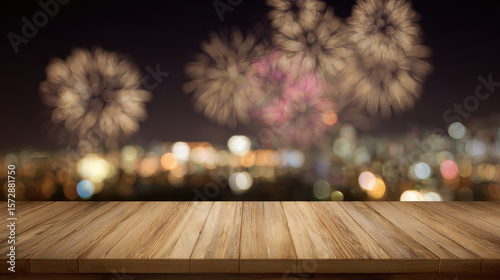 Wooden table with blurred rooftop background  balcony scene and fireworks on New Year’s Eve