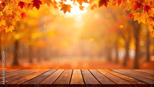 Fototapeta Naklejka Na Ścianę i Meble -  Warm autumn forest scene with wooden plank foreground and falling leaves