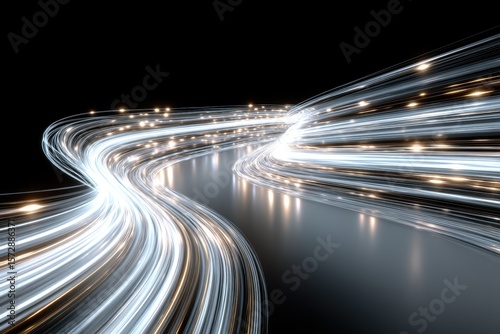 Abstract image of glowing light trails curving against a dark background, evoking speed, data, and futuristic technology.