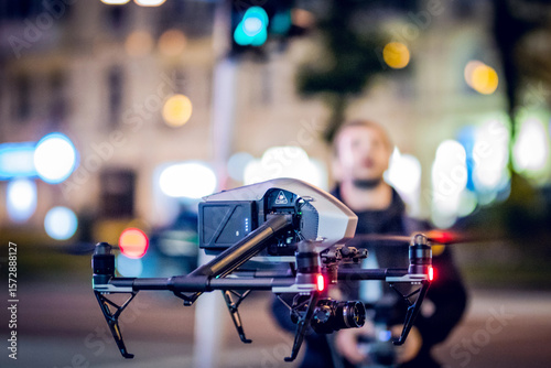 Fototapeta Naklejka Na Ścianę i Meble -  Drone lands on the street flying around city