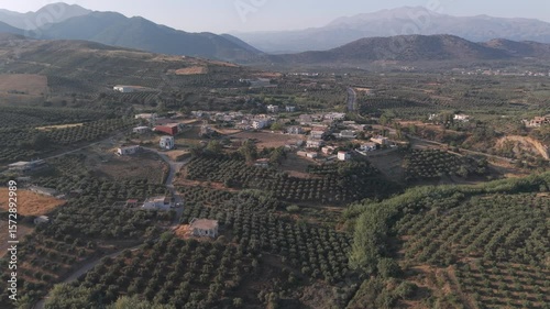 Fly with my drone along the North Crete part of the island with the nature rocks and the crystal clear water and olive tree landscape