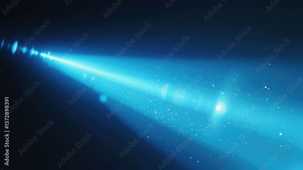 Fototapeta premium Bright blue light beam cutting through darkness with particles suspended in the air