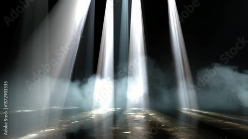 Powerful spotlights pierce through the fog on a dark stage, creating a dramatic atmosphere. An abstract background with directed light beams and smoke effects, creating volume and dynamics.